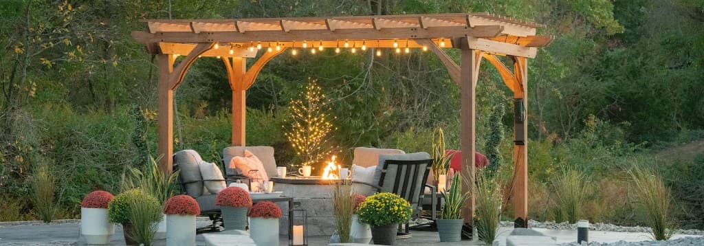 Pergola with outdoor furniture on a brick patio